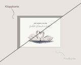 Zwei Herzen, ein Weg – Schwäne im Wasser